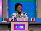 A contestant tries to solve a word